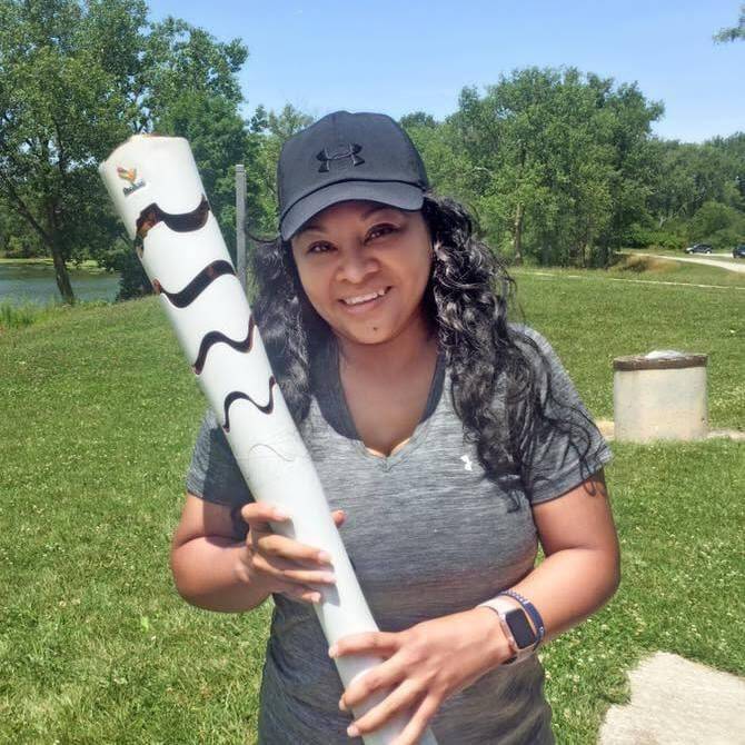 Cristina holds a torch bat