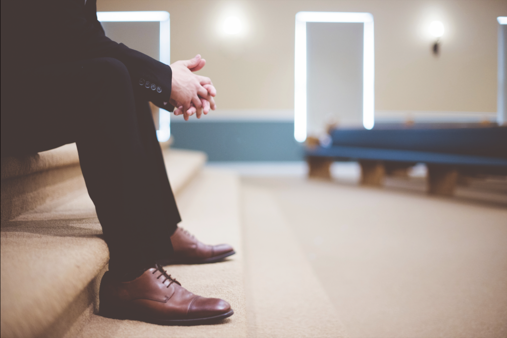 Pastor sitting on stage