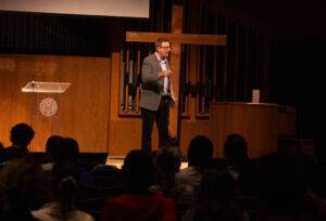 Dr. Firestone speaking in chapel. 