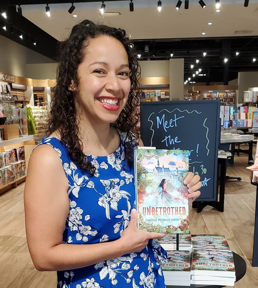 Candice Pedraza Yamnitz with her book