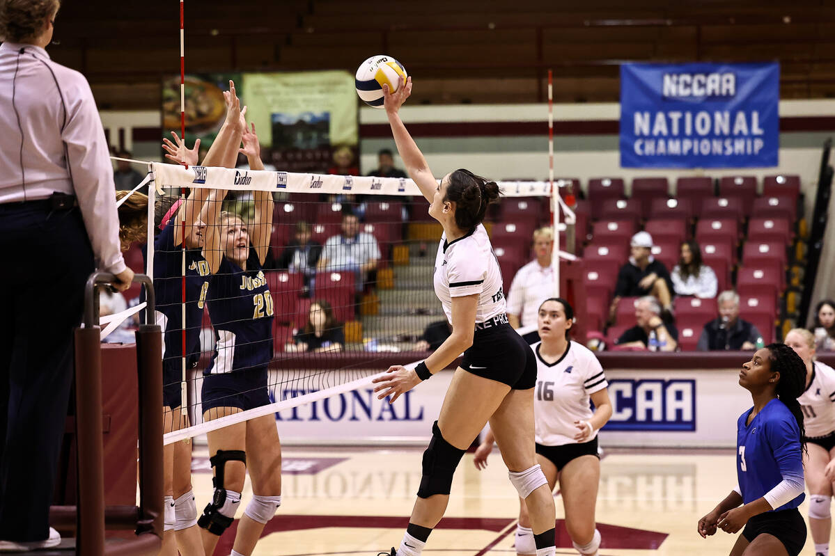 Outside Hitter Lana attacks the ball in match against Judson.